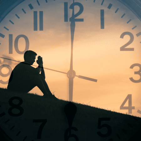 Therapy a man sitting with a big clock
